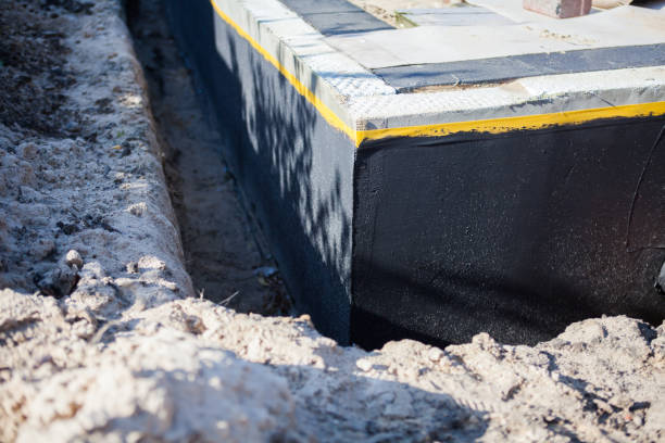 Professional Basement Waterproofing technician working in Canaan, IN